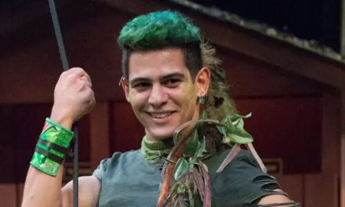 Young energetic man portraying Peter Pan.