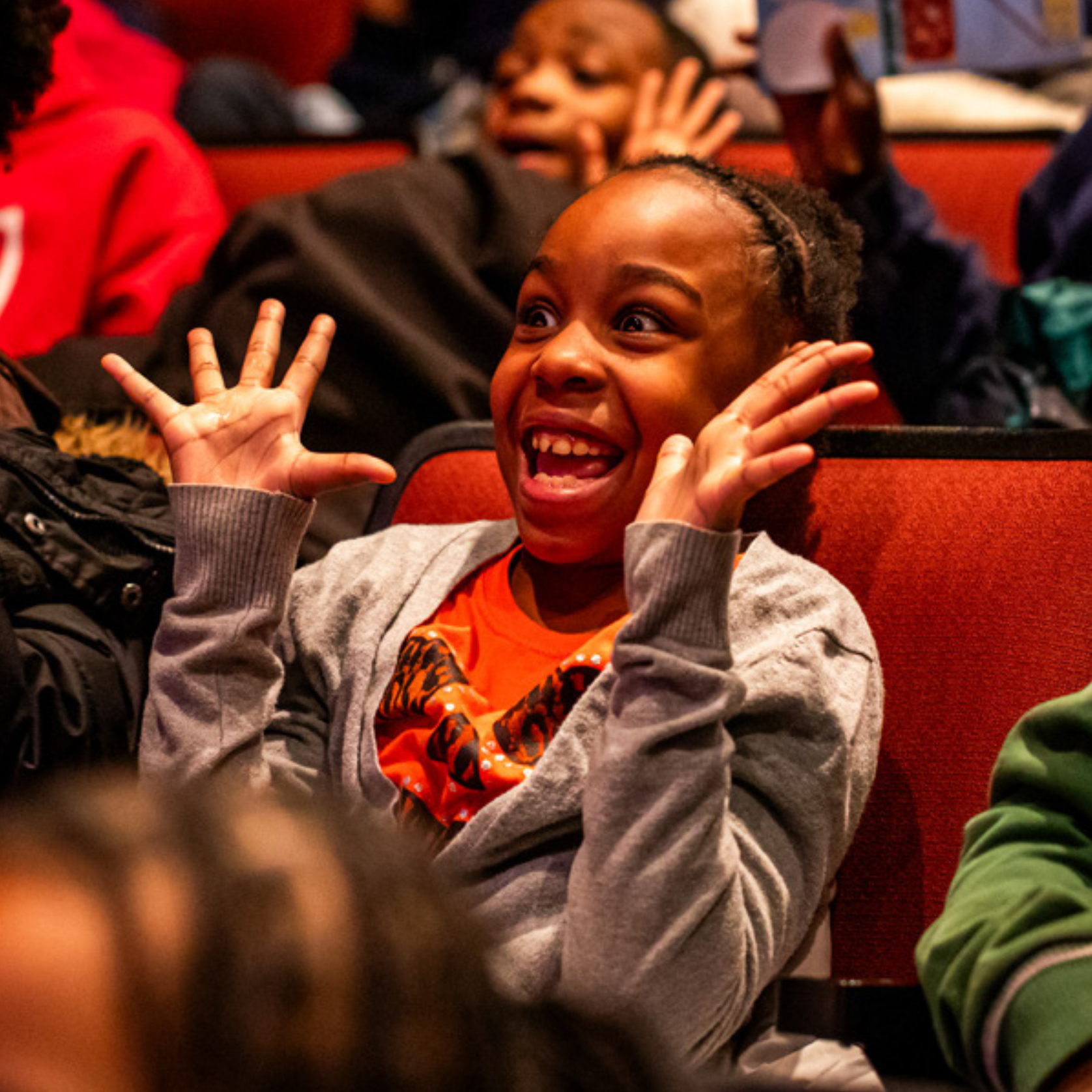CT Website Square_1 Happy elementary school age girl (jazz hands framing face)